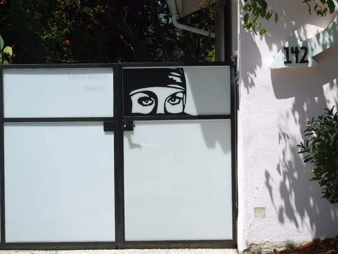 Woman's Face on Gate